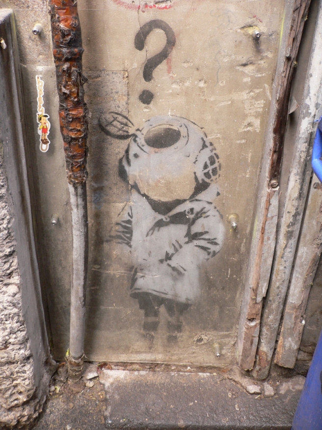 The ‘Little Diver’ by Banksy can be viewed in Cocker Alley, off Flinders Lane, Melbourne. The stencil has been protected by a clear perspex screen. 